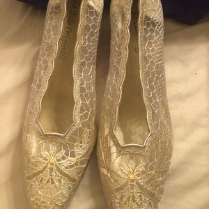 Lace wedding type shoes.